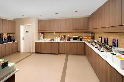 a large kitchen with wooden cabinets and a counter top at Residence Inn by Marriott Miami Airport West/Doral in Miami