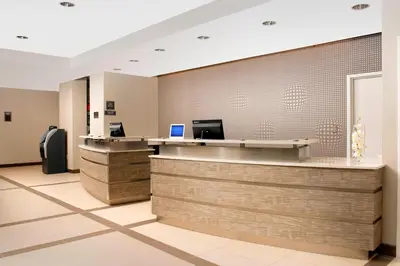 an office lobby with a reception desk and a counter at Residence Inn by Marriott Miami Airport West/Doral in Miami