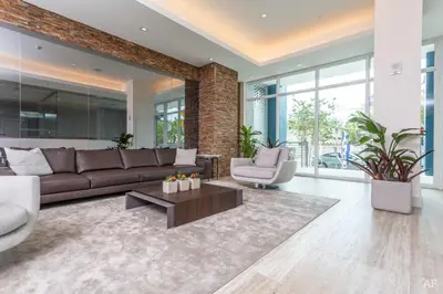 a living room with a couch and a table at Blueground Riverside pool nr Miami River MIA-155 in Miami