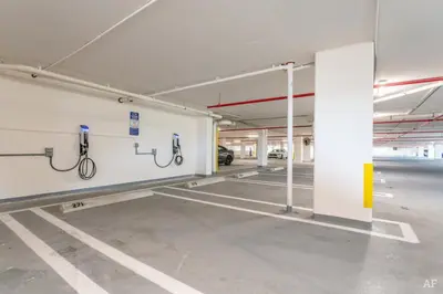 an empty parking lot with bike racks in a parking garage at Blueground Riverside pool nr Miami River MIA-155 in Miami