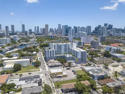 an aerial view of a city with tall buildings at Blueground Riverside pool nr Miami River MIA-155 in Miami