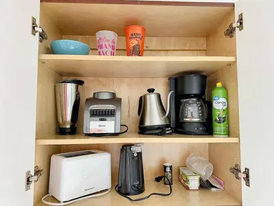 a kitchen pantry with various appliances on a shelf at Cottage with Hot Tub, Private Firepit, Entrance, Parking BBQ in Miami Gardens