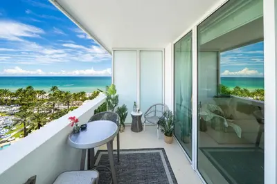 a balcony with a view of the ocean at Stunning Private Studio at Fontainebleau Sorrento - 802 in Miami Beach