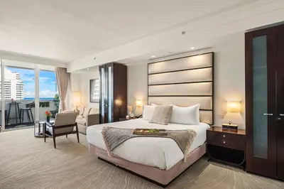 a bedroom with a king sized bed and a balcony at Stunning Private Studio at Fontainebleau Sorrento - 802 in Miami Beach