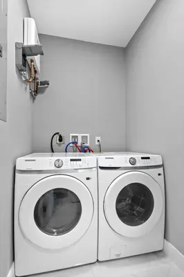 a white washer and dryer in a white room at Stylish Townhouse Steps from Wynwood in Miami