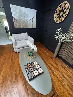 a living room with a table and a couch at 12 Guest-In The Center of It All in Miami