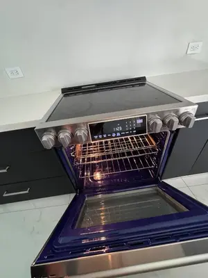 an oven with its door open in a kitchen at 12 Guest-In The Center of It All in Miami