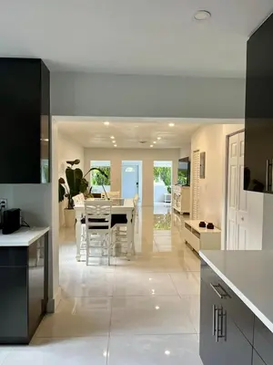 a kitchen and dining room with a dining table at North Miami Vacation Home in North Miami Beach