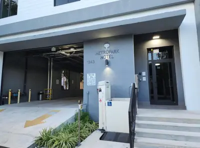 an entrance to a building with a refrigerator outside at MetroPark Hotel in Miami