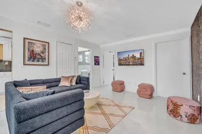 a living room with a couch and a table at The Pink Palm Little Havana Pool & Hot Tub in Miami