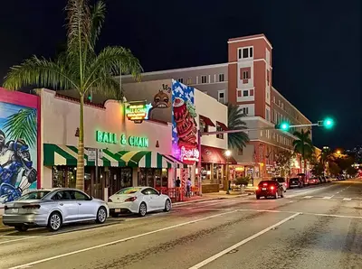 a city street at night with cars stopped at a traffic light at The Purple Paradise PoolHot Tub Little Havana in Miami