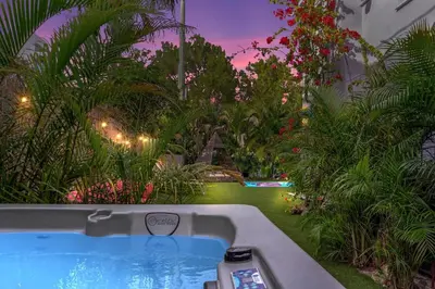 a bath tub in a room with a garden at The Purple Paradise PoolHot Tub Little Havana in Miami