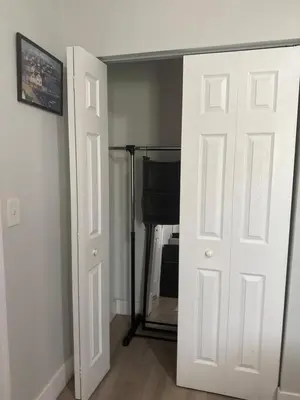 a white door in a room with a desk at Suite in Dania Beach in Dania Beach