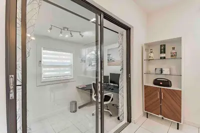 an office with a desk and a computer in a room at Villa Las Olas Designed with you in mind! in Fort Lauderdale