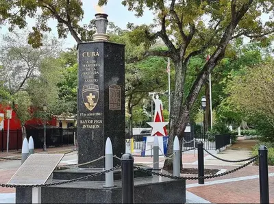 a monument in a park next to a tree at The Miami Tropic Suite - Private Stay with Free Parking in the Heart of Miami in Miami
