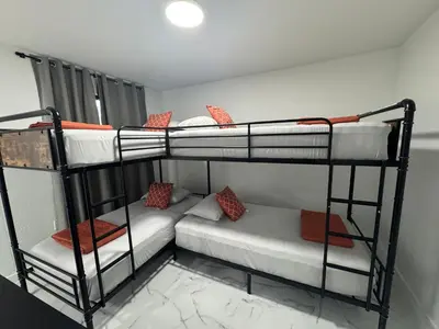 a room with two bunk beds and a couch at Welcome to Miami! in Miami