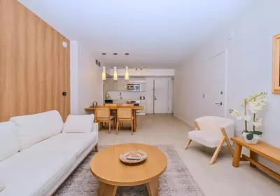 a living room with a white couch and a table at Luxury Ocean View Apartment 1208 Hallandale Beach in Hallandale Beach