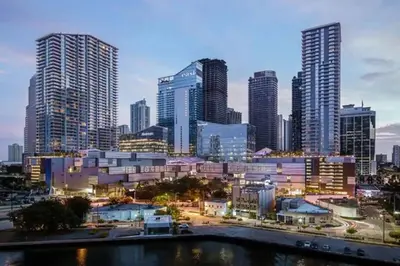 a city skyline with tall buildings and a river at Newly Renovated 1BR APT with Pool, Gym, and WFH in Miami