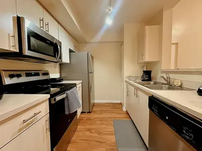 a kitchen with a sink and a refrigerator at 1B - 1B Apartment for 3 at Pembroke Pines in Pembroke Pines