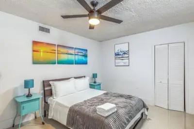 a bedroom with a bed and a ceiling fan at 1720 Wa Kee 1B · 4 Queen Beds Sleep 8 Pool Parking Wi-Fi Patio in Miami