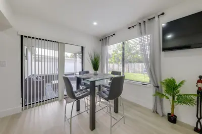 a dining room with a table and chairs at 3 Mi to Hard Rock Stadium Retreat with Private Yard in Miramar