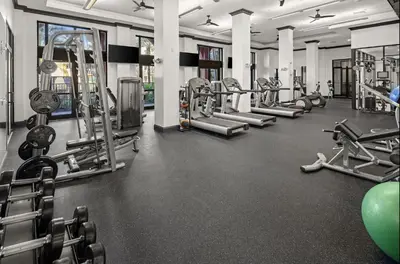 a gym with rows of treadmills and machines at Landing Spectacular 1BD Gym Clubhouse in Miramar