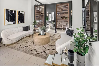 a living room with two white couches and a rug at Landing Spectacular 1BD Gym Clubhouse in Miramar