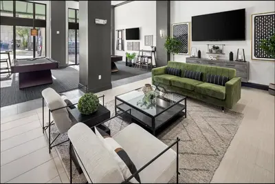 a living room with a couch and a table at Landing Spectacular 1BD Gym Clubhouse in Miramar