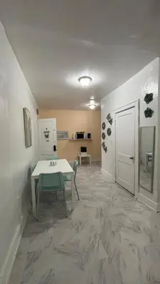 a dining room with a table and a table and a door at The Studio 6 Little Havana Walk to Marlins Stadium in Miami