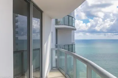 a view of the ocean from the balcony of a building at Marenas Beach Resort Private Luxury Suites in Miami Beach