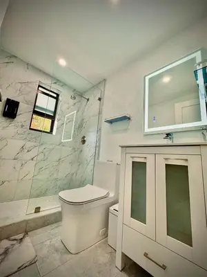 a bathroom with a shower and a toilet and a sink at Miami Vibes in Miami