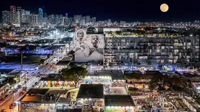 a view of a city at night with a large building at Miami Vibes in Miami
