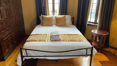 a bedroom with a large bed in a room at Young Mansion Steps To The Beach in Hollywood