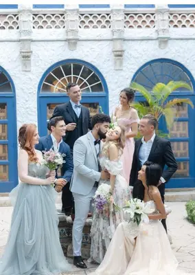 a bride and groom and their wedding party at Young Mansion Steps To The Beach in Hollywood