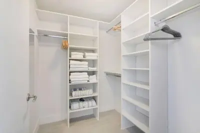 a white bathroom with a shower and white towels at Luxury Corner Apartment in Hollywood Beach in Hollywood
