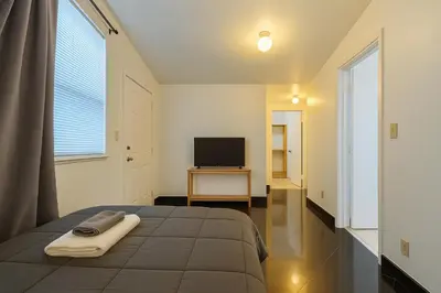 a bedroom with a bed and a television on a table at Stylish Wynwood studio in Miami
