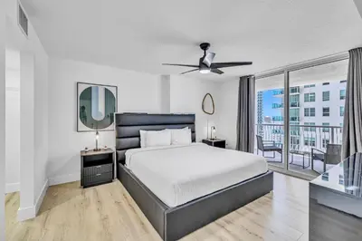 a bedroom with a bed and a large window at Amazing property with amenities in Miami