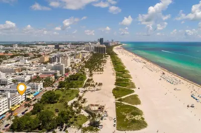 an aerial view of a beach and the ocean at Heart of South Beach Studio Roof Top Pool Balcony in Miami Beach