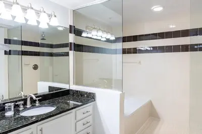 a bathroom with a sink and a mirror at Landing Apartments - Fort Lauderdale in Fort Lauderdale