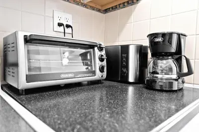a kitchen counter with a microwave and a coffee maker at Amazing 1bed on Hollywood Beach Boardwalk W Pool in Hollywood