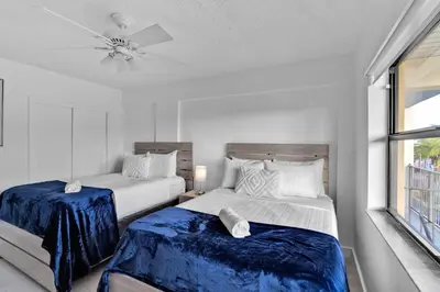 a bedroom with two beds and a ceiling fan at Amazing 1bed on Hollywood Beach Boardwalk W Pool in Hollywood