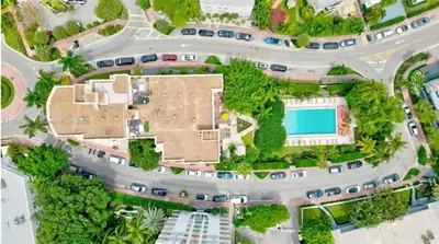 an overhead view of a parking lot with a building at Tropical South Beach Condo - Pool & Miami Beach Vibes in Miami Beach