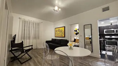 a living room with a table and a couch at Nice 2 bedrooms near the beach in Miami Beach