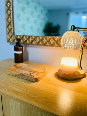 a desk with a lamp and a cutting board on it at Balcony 2BR Apartment with Free Parking near Freedom Park & Brickell in Miami