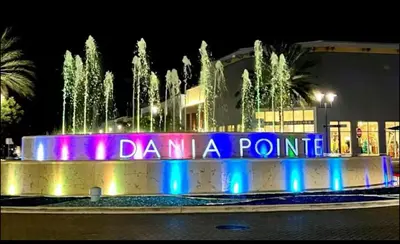 a fountain with a sign that reads dana point at 4bdrm Waterfront salt water Pool home with Outdoor theater Game Rm Make up vanities in every room Perfect for Game days and concerts trips to Miami Hard rock stadium and hotel 15 mins away in Miramar