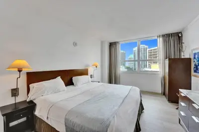 a bedroom with a large bed and a large window at Spacious 2BR in Miami Bay Views plus Balcony in Miami