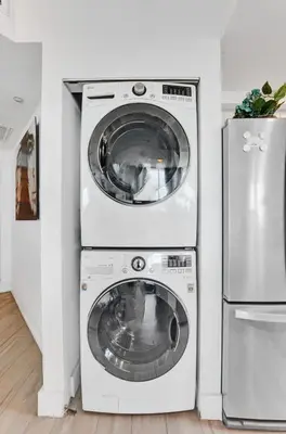 a washer and dryer next to a refrigerator at Spacious 2BR in Miami Bay Views plus Balcony in Miami
