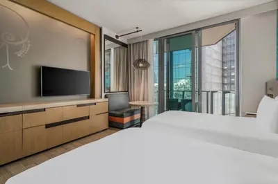 a bedroom with a large bed and a television at EAST Miami in Miami