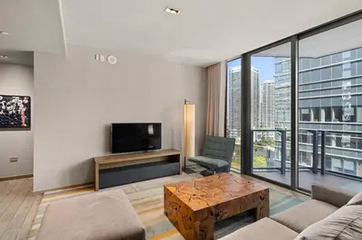 a living room with a couch and a tv at EAST Miami in Miami