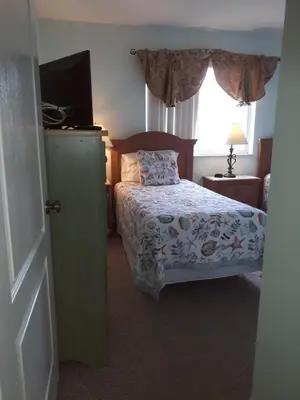 a bedroom with a bed and a window at Charming Kendall Home in Kendall